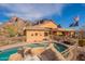 Backyard pool with rock waterfall and mountain views at 3086 N Herrala Way, Apache Junction, AZ 85119