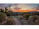 Putting green surrounded by desert landscaping, offering a scenic view and recreational space at 3086 N Herrala Way, Apache Junction, AZ 85119