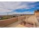 Spacious rooftop deck offering panoramic views of the city and mountains, complete with a safety railing and stairs at 3086 N Herrala Way, Apache Junction, AZ 85119
