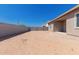 Expansive backyard with block wall, ideal for creating a private outdoor space at 31476 N Hayweather Ln, San Tan Valley, AZ 85143