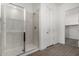 Modern bathroom features a walk-in shower with marble tile and glass door at 31476 N Hayweather Ln, San Tan Valley, AZ 85143