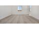 Spacious bedroom with carpet, two windows and electrical outlets at 31476 N Hayweather Ln, San Tan Valley, AZ 85143