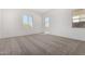 Light-filled bedroom featuring plush carpeting and ample natural light at 31476 N Hayweather Ln, San Tan Valley, AZ 85143