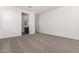 Large bedroom with ensuite bathroom and plush grey carpeting at 31476 N Hayweather Ln, San Tan Valley, AZ 85143