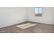Bedroom with tile floors, a window, and a door at 31476 N Hayweather Ln, San Tan Valley, AZ 85143