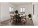 Bright dining room with modern decor featuring a round table, stylish chairs, and natural light at 31476 N Hayweather Ln, San Tan Valley, AZ 85143
