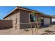 Exterior view of a new construction home featuring low maintenance desert landscaping at 31476 N Hayweather Ln, San Tan Valley, AZ 85143