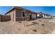 Exterior view of a new construction home featuring low maintenance desert landscaping at 31476 N Hayweather Ln, San Tan Valley, AZ 85143