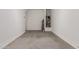 Garage interior featuring painted concrete floor, water heater and door to interior of house at 31476 N Hayweather Ln, San Tan Valley, AZ 85143