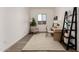 Inviting home office featuring a desk, comfortable chair, decorative ladder, and natural light at 31476 N Hayweather Ln, San Tan Valley, AZ 85143