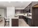 Well-appointed kitchen featuring a central island, sleek cabinetry, and stylish pendant lighting at 31476 N Hayweather Ln, San Tan Valley, AZ 85143