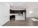 Modern kitchen with stainless steel appliances, an island, and lots of storage at 31476 N Hayweather Ln, San Tan Valley, AZ 85143