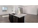 Stylish island with stainless steel dishwasher, sink and a modern faucet at 31476 N Hayweather Ln, San Tan Valley, AZ 85143