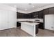 Beautiful kitchen with a center island and a door to the right at 31476 N Hayweather Ln, San Tan Valley, AZ 85143