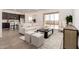 Stylish living room with backyard access, seamlessly connecting indoor and outdoor spaces at 31476 N Hayweather Ln, San Tan Valley, AZ 85143