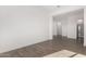 Versatile room showcasing wood-look tile flooring and neutral paint, ready for personalization and style at 31476 N Hayweather Ln, San Tan Valley, AZ 85143