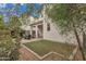Backyard featuring a covered patio with porch swing, a fire pit, and small grassy area at 367 N 157Th Ln, Goodyear, AZ 85338
