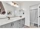 Well-lit bathroom with dual sinks, modern fixtures, and ample counter space, offering convenience and style at 367 N 157Th Ln, Goodyear, AZ 85338