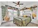 Stylish bedroom featuring a hanging chair, a cozy bed, and unique decorative touches creating a relaxing retreat at 367 N 157Th Ln, Goodyear, AZ 85338