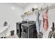 Well-equipped laundry room with modern appliances and ample storage, making chores a breeze at 367 N 157Th Ln, Goodyear, AZ 85338