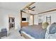 Bright and airy main bedroom with a four-poster bed, walk-in closet, and ensuite bathroom at 367 N 157Th Ln, Goodyear, AZ 85338
