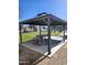 Shaded picnic area with seating for gatherings, located near community pool at 367 N 157Th Ln, Goodyear, AZ 85338