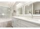 Elegant bathroom with a separate tub, dual sinks, decorative tiles, and modern fixtures at 3807 N Kings Peak --, Mesa, AZ 85215