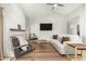 Bright living room with a stone fireplace and a ceiling fan at 3807 N Kings Peak --, Mesa, AZ 85215