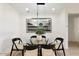 Cozy dining room with a modern table and seating, complemented by natural light and minimalist decor at 3890 E Dublin St, Gilbert, AZ 85295