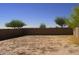 Spacious backyard with a wall around the property for added privacy at 44493 W Cypress Ln, Maricopa, AZ 85138