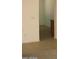 Hallway with neutral carpet leading to other parts of the home at 44493 W Cypress Ln, Maricopa, AZ 85138