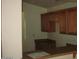 Kitchen featuring upper cabinets and a breakfast bar at 44493 W Cypress Ln, Maricopa, AZ 85138