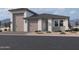 Beautiful single-story home featuring a modern elevation, well-manicured landscaping and a three car garage at 5520 W Hopi Trl, Laveen, AZ 85339