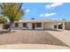 Charming single-story home featuring a covered carport, desert landscaping, and a welcoming front entrance at 553 S Sunwood Cir, Mesa, AZ 85204