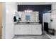 Stylish bathroom boasts a double sink vanity with sleek white cabinetry and plenty of counter space at 651 N Ironwood Dr # 1, Apache Junction, AZ 85120