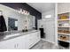 Modern primary bathroom featuring double sinks, lots of storage, and a glass enclosed shower at 651 N Ironwood Dr # 1, Apache Junction, AZ 85120