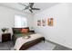 Bright bedroom with a large window, ceiling fan, and tasteful decor creates a peaceful and inviting atmosphere at 651 N Ironwood Dr # 1, Apache Junction, AZ 85120