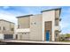 Modern townhome exterior with contemporary design, a garage, and low-maintenance landscaping at 651 N Ironwood Dr # 1, Apache Junction, AZ 85120
