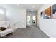 Open hallway with neutral tones leads to various rooms, creating a cohesive and flowing living space at 651 N Ironwood Dr # 1, Apache Junction, AZ 85120