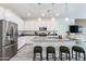 This modern kitchen has white cabinets, stainless steel appliances, and a large island with seating at 651 N Ironwood Dr # 1, Apache Junction, AZ 85120