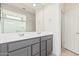 Bathroom featuring a double sink vanity and a glass shower at 6722 W Desert Dr, Laveen, AZ 85339