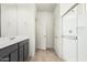 Bathroom with a double sink vanity, shower and tile floors at 6722 W Desert Dr, Laveen, AZ 85339