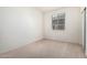 Bedroom featuring neutral carpet, white painted walls, window with blinds, and closet at 6722 W Desert Dr, Laveen, AZ 85339