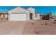 Charming single-story home with desert landscaping, a two-car garage, and a welcoming front entrance at 6722 W Desert Dr, Laveen, AZ 85339