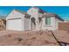 Charming single-story home with desert landscaping, a two-car garage, and a welcoming front entrance at 6722 W Desert Dr, Laveen, AZ 85339