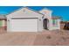Charming single-story home with desert landscaping, a two-car garage, and a welcoming front entrance at 6722 W Desert Dr, Laveen, AZ 85339
