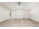 Spacious garage with concrete flooring, water heater, and entry door at 6722 W Desert Dr, Laveen, AZ 85339