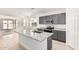 Modern kitchen with granite counters, stainless appliances and kitchen island at 6722 W Desert Dr, Laveen, AZ 85339