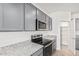 This kitchen features granite countertops and stainless steel appliances at 6722 W Desert Dr, Laveen, AZ 85339