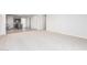 Bright living room showcasing an open floor plan and neutral carpet at 6722 W Desert Dr, Laveen, AZ 85339